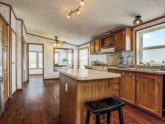 Alternate view of the kitchen and dining area.