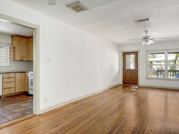 Kitchen located off the living room and dining room