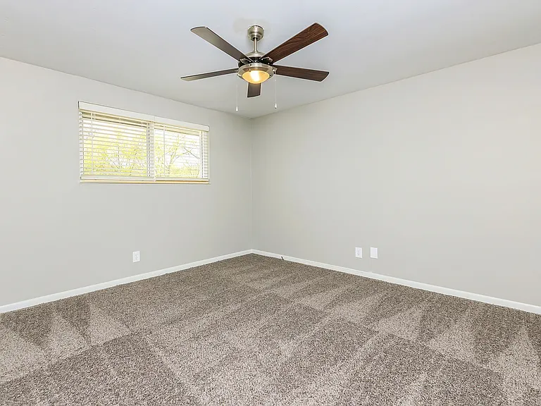 Bedroom with carpet & ceiling fan