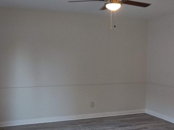 Spacious Dining with Ceiling Fan.