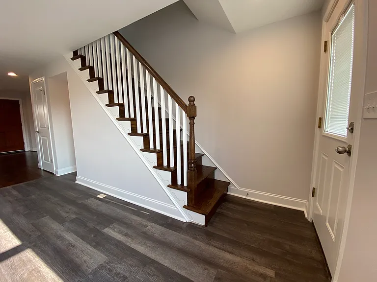 Kitchen w/steps to upper level & walkout to deck