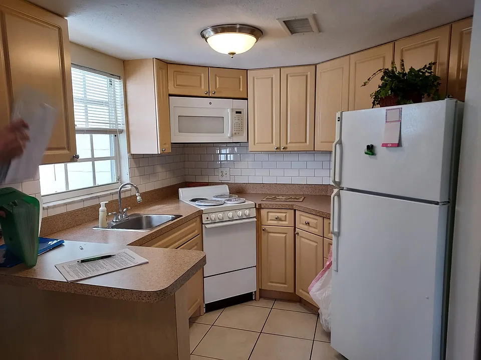 Kitchen with stove microwave refrigerator and dishwasher