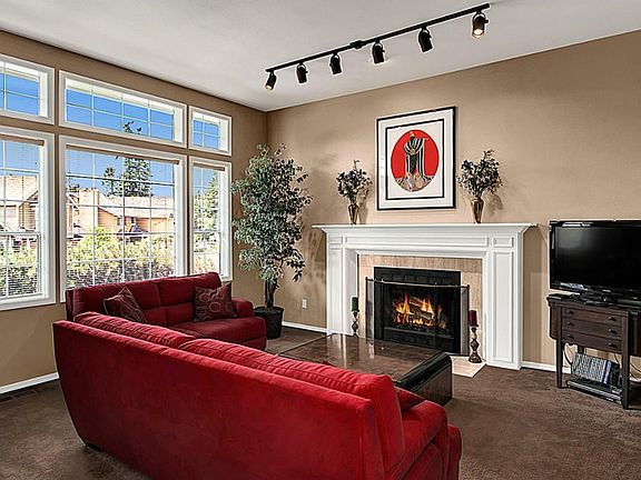 formal living room with wood fireplace