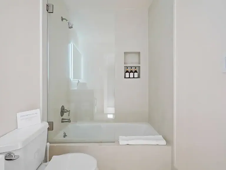 Sleek bathtub, perfect for unwinding after a beach day.
