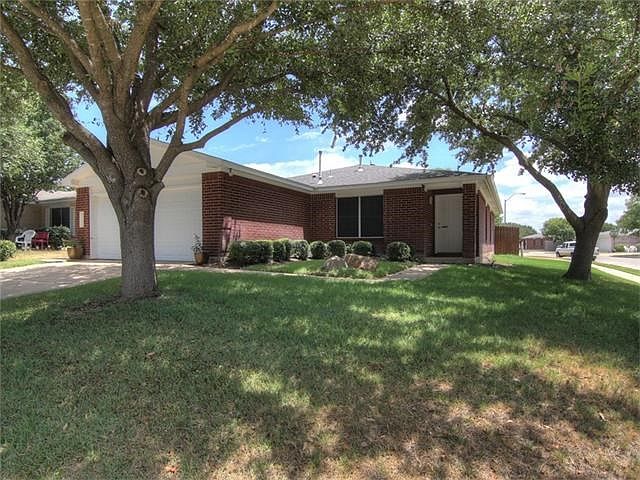 Pride of ownership shows in this Red Brick Home. Situated on a corner lot with Mature Trees and land