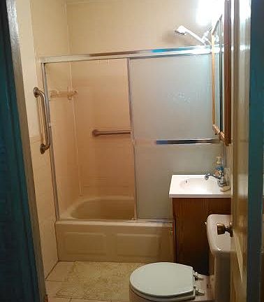 Bathroom, with sliding door shower and a beautiful tile floo