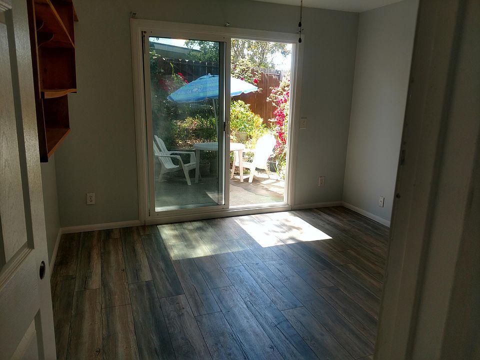 Back bedroom, slider door to private patio, book shelves