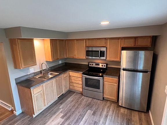 custom concrete countertops, stainless appliances