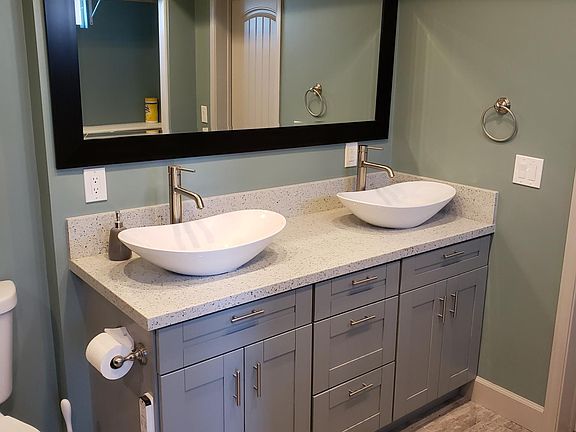 Primary bathroom with dual vessel sinks