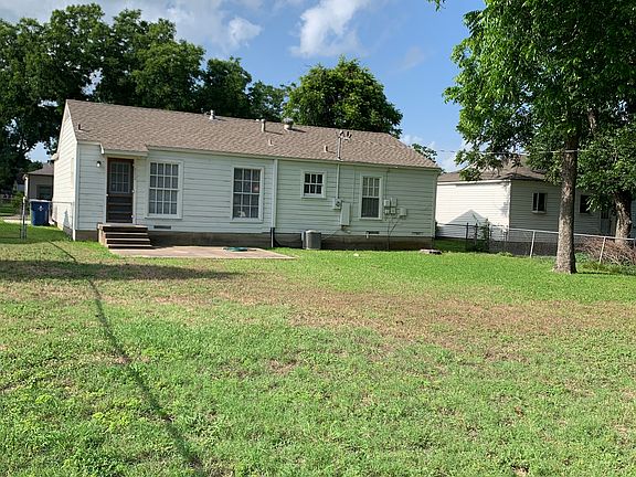 Backyard view with morning shade trees and back patio