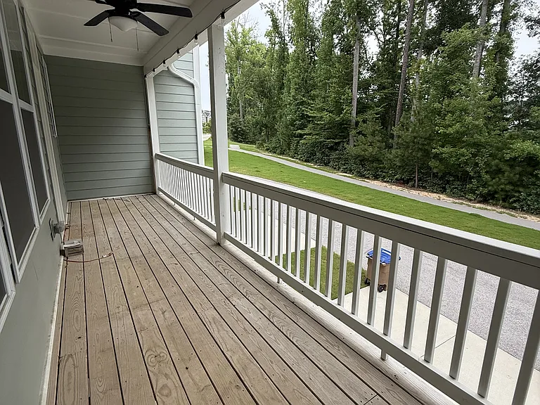 Private balcony off of the kitchen facing the back.