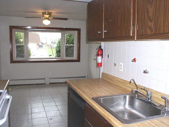 kitchen with large bay window and new appliances
