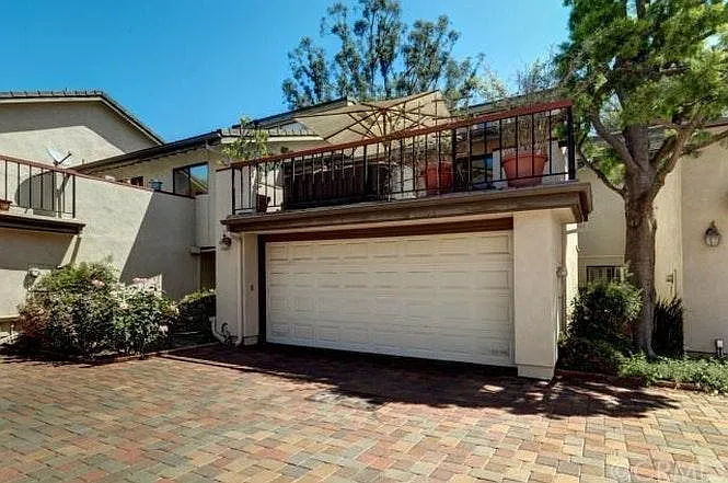 1 car- garage with automated-gated front entry way and a bal