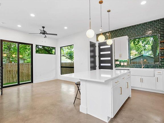 Open Living Room with Patio and natural lighting