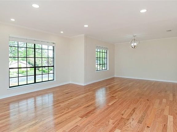 Formal Dining is to the far right with an opening to the Kitchen.