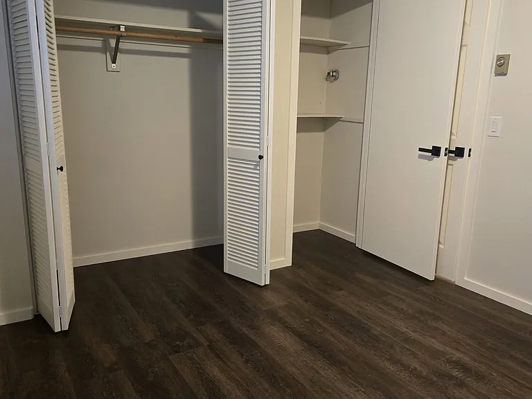 S. bedroom with closets open.