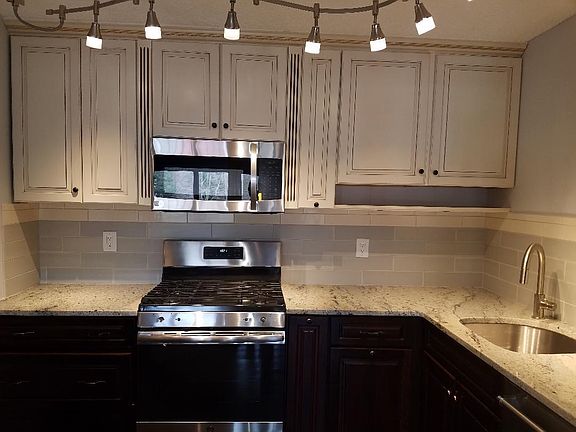 NEW kitchen cabinets, NEW granite countertops, NEW backslash, NEW stove/oven, NEW Microwave, NEW refrigerator, NEW dishwasher, NEW Sink, NEW facet, NEW light fixture . CLEAN