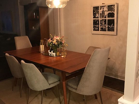 Large dining room with west elm fixture.