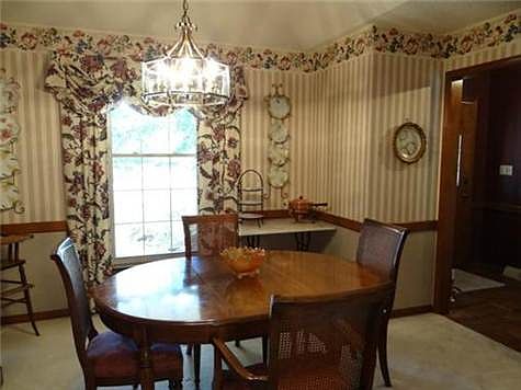 The Formal Dining Room With Cathedral-Like Ceilings & Built-Ins