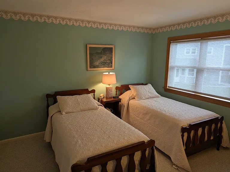 guest bedroom furnished with twin beds & quality mattresses.