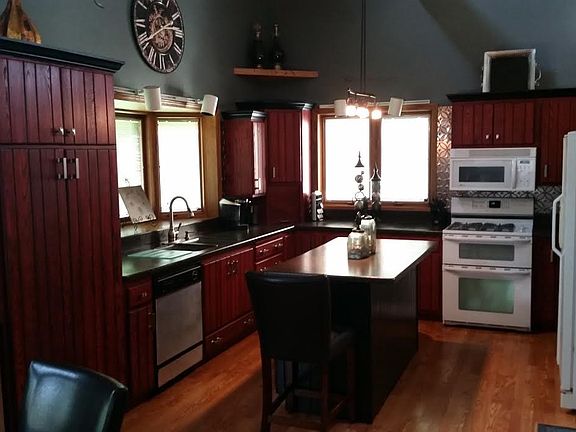Refinished cabinets and hard surface counter tops.