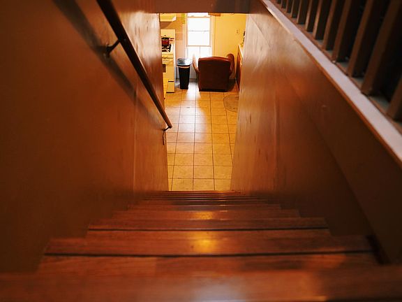 Staircase (Looking down from 3rd-floor living room to 2nd-floor kitchen area)