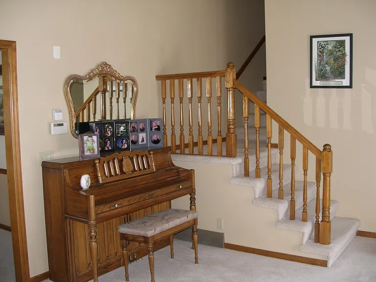 Front Living Room with Stairway to Upstairs