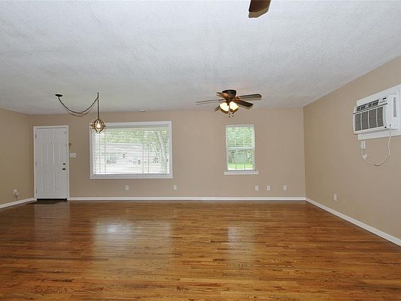 Step inside this light and bright home to find neutral colors that compliment the real wood floors that flow throughout most rooms.