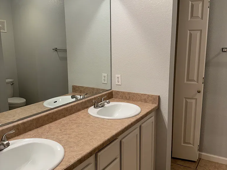 The master bedroom includes a full bathroom and a closet.