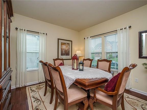 The front room currently used as a dining room. Can be a sitting room, office, music room...