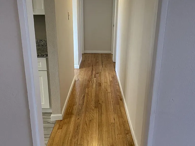 Hallway to 3 bedrooms, bathroom