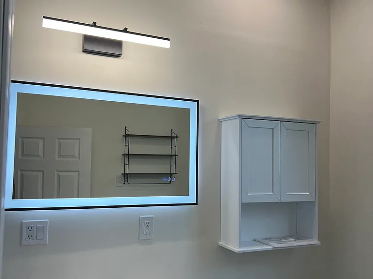 Full bathroom #1: Vanity, mirror, toilet