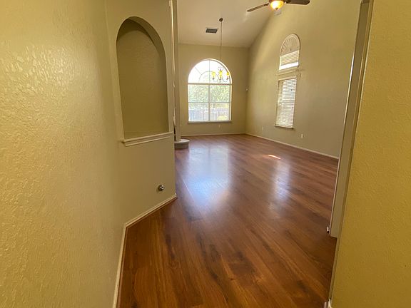 View from entry, into family room. Downstairs bed/bath on right.