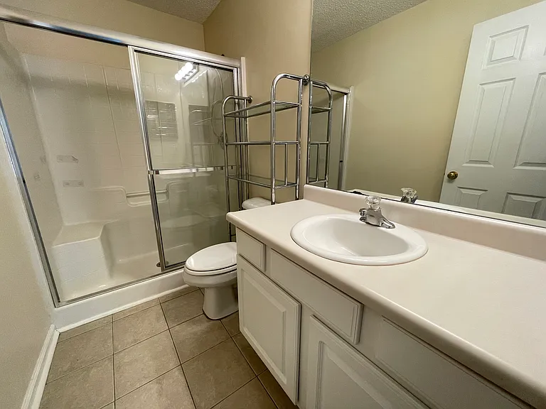 Master bathroom with glass enclosed walk-in shower