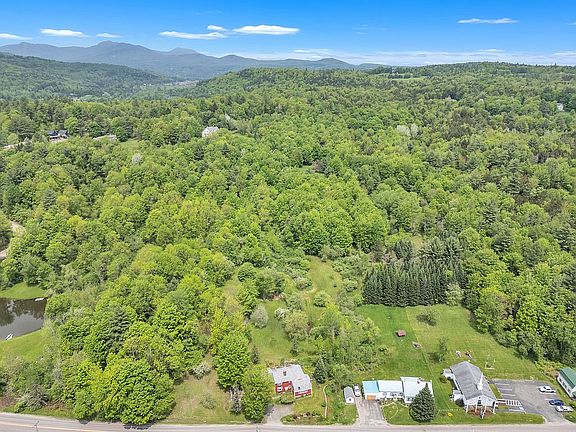 Land extends behind church.