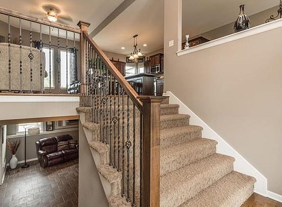 Extra wide stairway provides access to the spacious open floor plan.