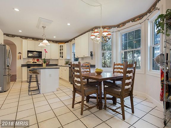 Large kitchen featuring bay window