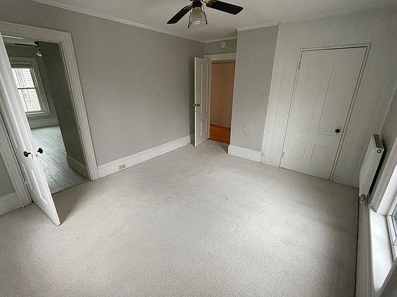 Front bedroom which is carpeted.