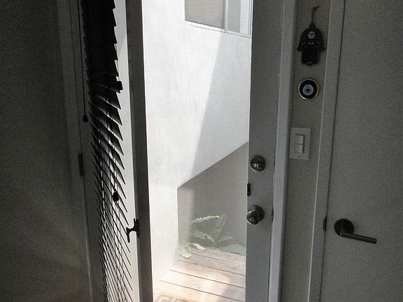 Front door is Santa Barbara door. Perfect for sunny southern California living.