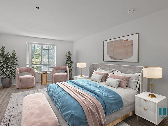 Spacious Bedroom with Large Windows and Vinyl Flooring