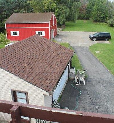 View from Deck of Garage and Barn