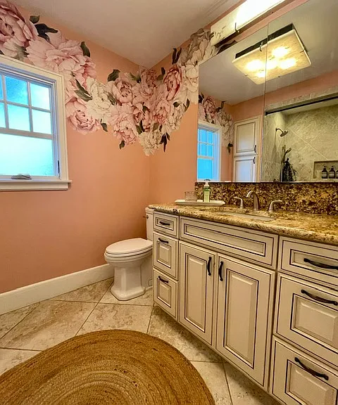So pretty and functional! Lots of cabinet space behind the mirrors!