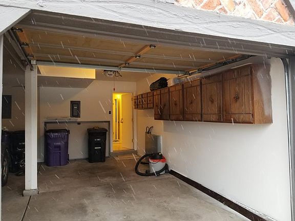 Shared attached garage with plenty of storage space. 2 garage door openers. We pay for waste removal and recycling.