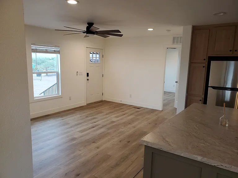 KITCHEN LOOKING INTO FRONT ROOM