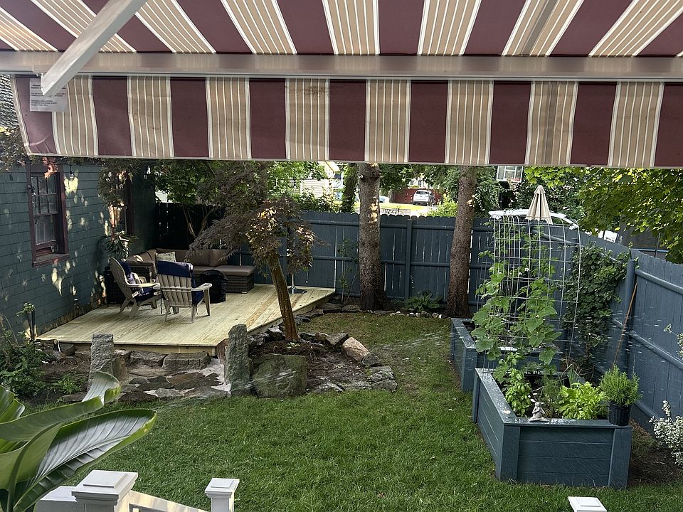 backyard - raised garden beds, 2 decks awnings 2 car garage
