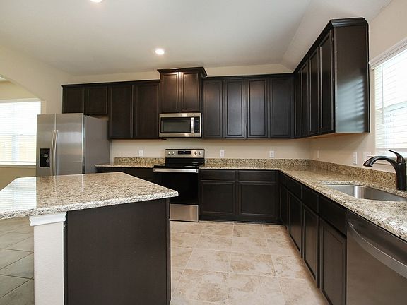 Enjoy a full suite of appliances by Whirlpool in this move-in ready home at Bauer Landing