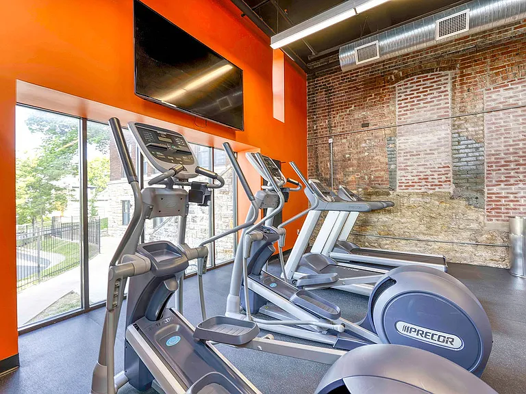 Eliptical machines, treadmills, large windows and large tv