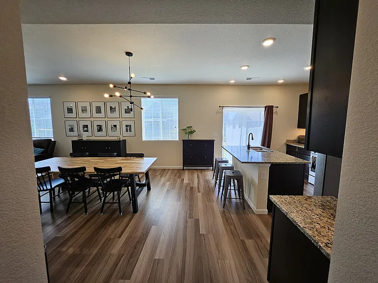 Walking into main area, downstairs, dining room.