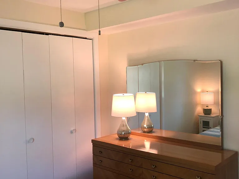 Dresser with mirror/hairdryer, ceiling fan and closet in Bedroom #2.