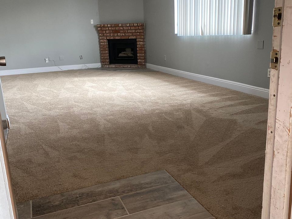 Welcome home! Newly tiled entryway, new carpet, new baseboards, fresh paint!